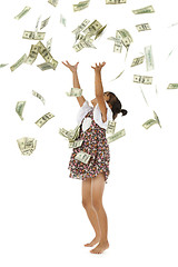 Image showing pretty girl throwing money