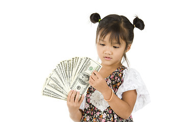 Image showing little girl counting us dollars