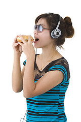 Image showing  woman with hamburger, sunglasses and head phones