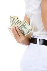 Image showing woman hiding money