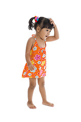 Image showing confused girl scratching her head