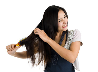 Image showing woman brushing her hair