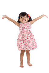 Image showing girl in studio with arms outstretched