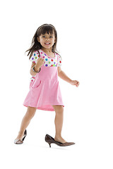 Image showing little girl with oversized shoes