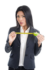 Image showing business woman with ruler 