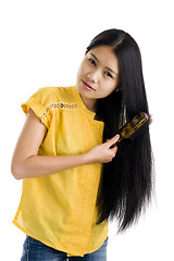 Image showing woman brushing her hair