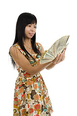 Image showing woman starring at money