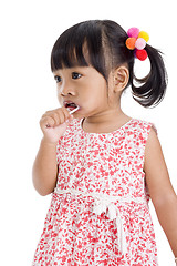 Image showing cute little girl with a lollipop 