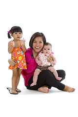 Image showing happy mother with two sweet girls