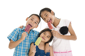 Image showing siblings eating ice creams