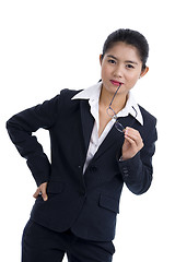 Image showing business woman holding her glasses