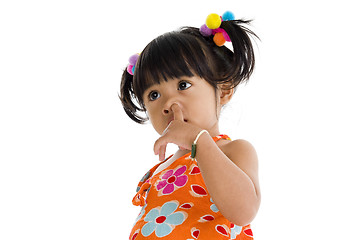 Image showing Little girl picking her nose