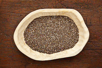 Image showing chia seeds in a rustic bowl