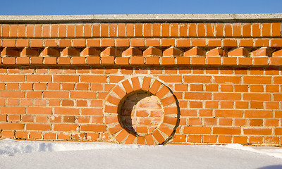 Image showing Red brick wall fragment details in winter.