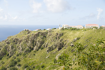 Image showing typical houses on cliff mountain over Caribbean Sea Saba Dutch N