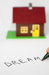 Image showing Text Dream and house on background. 