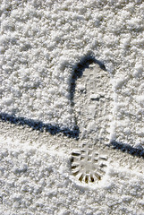 Image showing Human foot and bicycle wheel imprint 