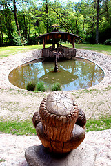 Image showing Round cobbly stoned pond 