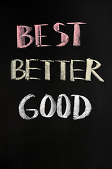 Image showing Best,better and good text written on blackboard