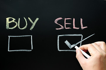 Image showing Buy or sell check boxes on blackboard