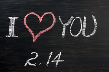 Image showing Love with valentine 's date drawn on a chalkboard