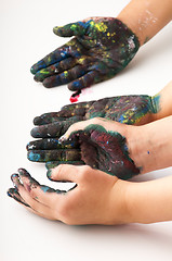 Image showing Kids hands covered with paint 