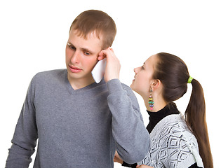 Image showing Boy and girl talking on a cell phone