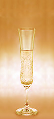 Image showing a glass  of champagne on yellow background