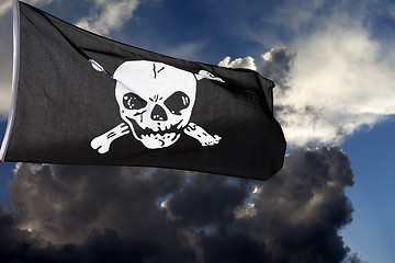 Image showing Jolly Roger (pirate flag) against storm clouds