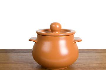 Image showing Kitchen clay pot on the wooden board
