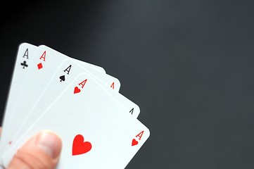 Image showing hand holding four aces