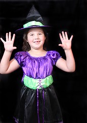 Image showing Halloween witch with arms up