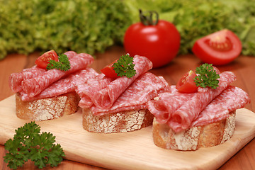 Image showing Fingerfood with salami and tomatos