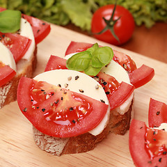 Image showing Fingerfood with mozzarella cheese and tomatos