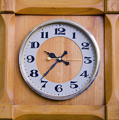 Image showing Clock in wooden box showing twentyseven past nine.