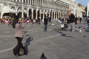 Image showing A tourist is jumping up