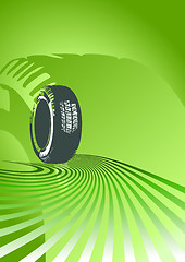 Image showing Brand new tire on a green background