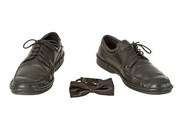 Image showing Man's shoe and bow tie