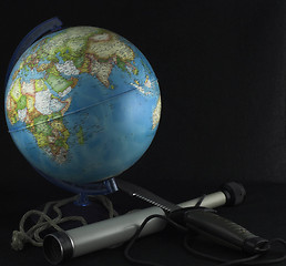 Image showing globe and a spyglass