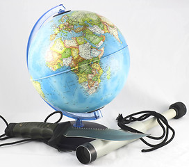 Image showing globe and a spyglass