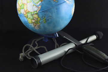 Image showing globe and a spyglass