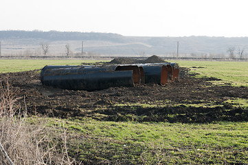 Image showing Old metal pipes dismantled for scrap 