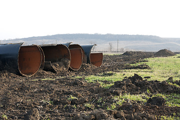 Image showing Old metal pipes dismantled for scrap 