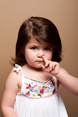 Image showing Toddler with finger in nose