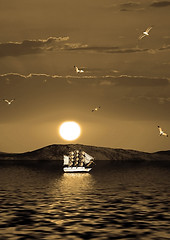 Image showing Sailing vessel against the coming sun