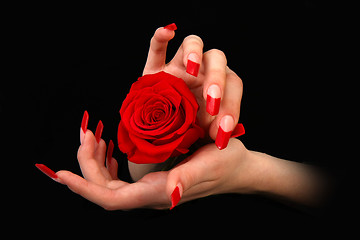 Image showing Human fingers with long fingernail and beautiful manicure isolated on black