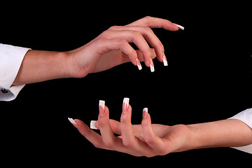 Image showing Human fingers with long fingernail and beautiful manicure isolated on black