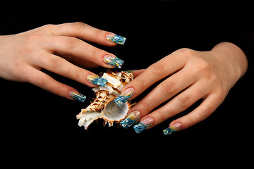 Image showing Human fingers with long fingernail and beautiful manicure isolated on black