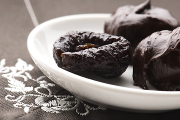 Image showing Dried plums in chocolate 