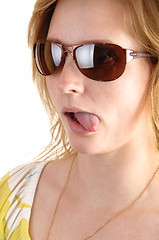 Image showing Girl shows tongue.